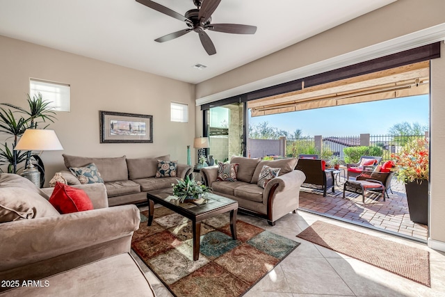 tiled living room with a ceiling fan and visible vents