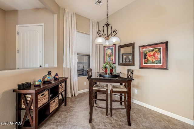 dining space with tile patterned flooring, visible vents, and baseboards