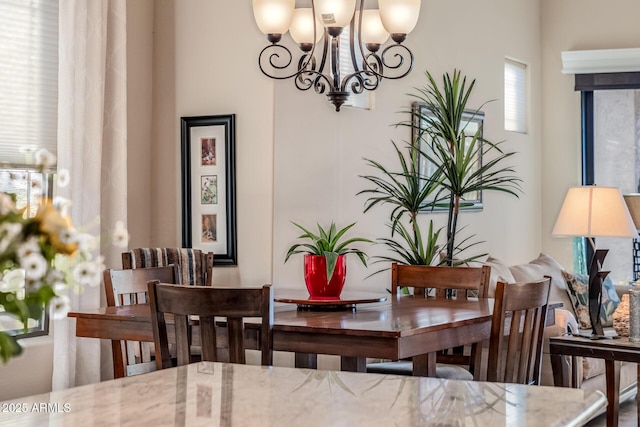 dining area featuring an inviting chandelier