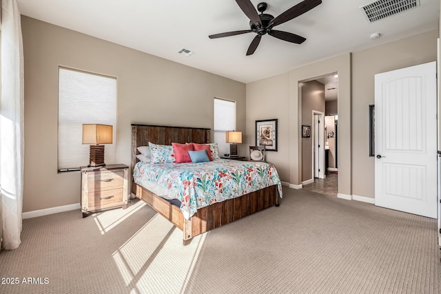 bedroom with visible vents, carpet floors, and baseboards