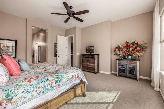 bedroom with visible vents, light carpet, baseboards, and a ceiling fan