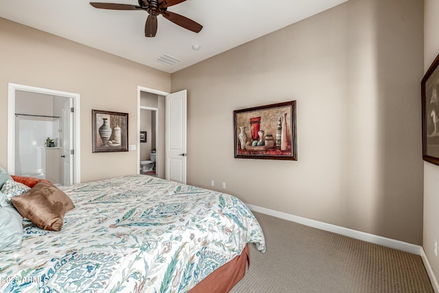 carpeted bedroom featuring ceiling fan, baseboards, visible vents, and connected bathroom