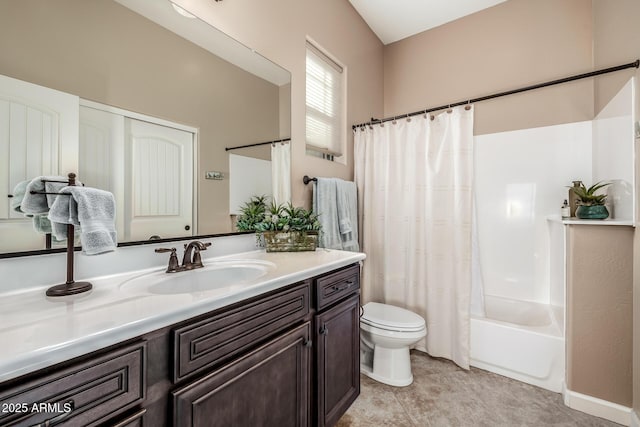 bathroom with tile patterned flooring, toilet, vanity, and shower / bath combo