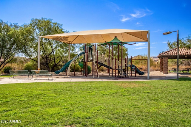 communal playground featuring a lawn