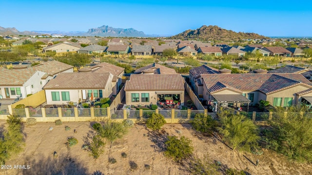 birds eye view of property with a mountain view and a residential view