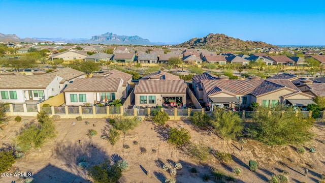 birds eye view of property with a residential view and a mountain view