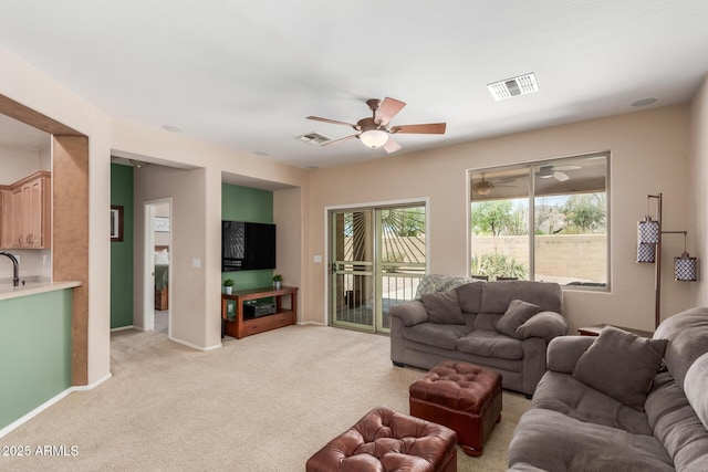 2342 W Owens Ct, Anthem, AZ 85086 - living room featuring ceiling fan, light carpet, and baseboards