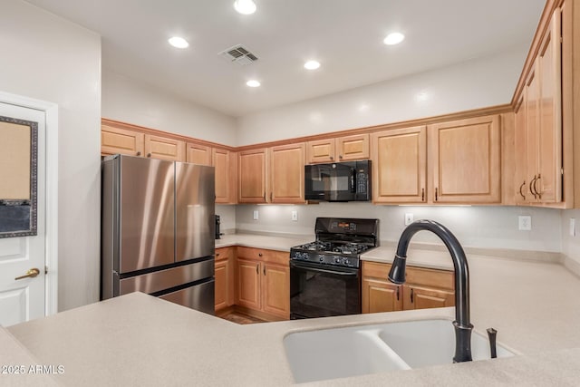 2342 W Owens Ct, Anthem, AZ 85086 - kitchen featuring black appliances, a sink, recessed lighting, and light countertops