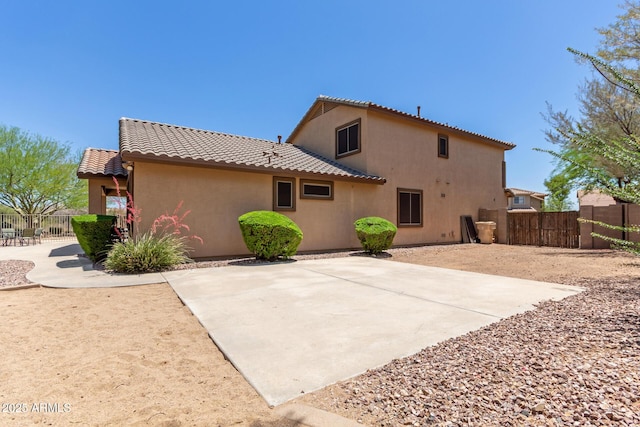 2342 W Owens Ct, Anthem, AZ 85086 - back of property with a tiled roof, stucco siding, and a patio area