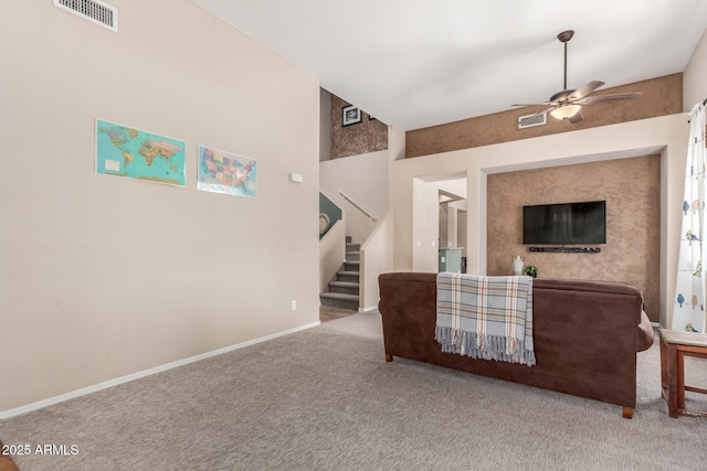 2342 W Owens Ct, Anthem, AZ 85086 - living room featuring a ceiling fan, carpet flooring, stairs, and baseboards