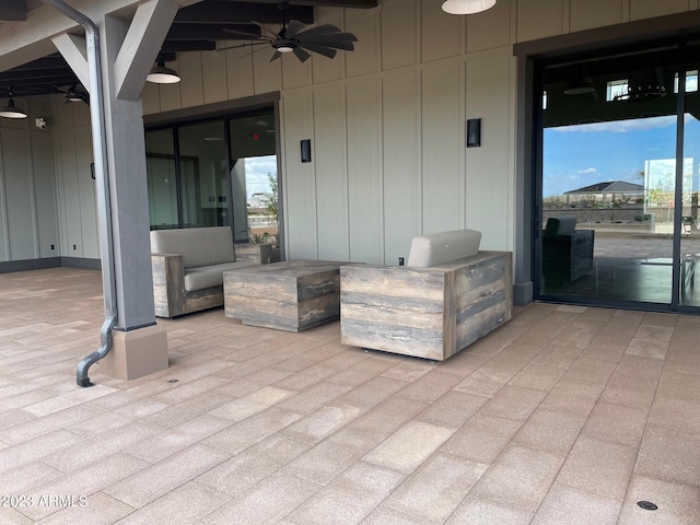 view of patio featuring ceiling fan