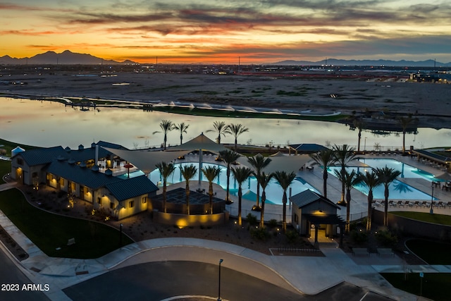 aerial view at dusk with a water and mountain view