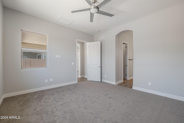 unfurnished bedroom featuring ceiling fan and carpet floors