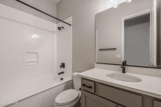 full bathroom with vanity, toilet, and shower / washtub combination