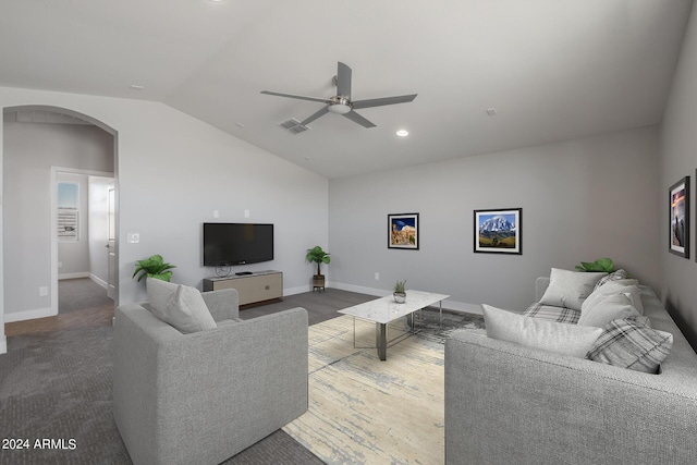 living room featuring carpet, ceiling fan, and lofted ceiling