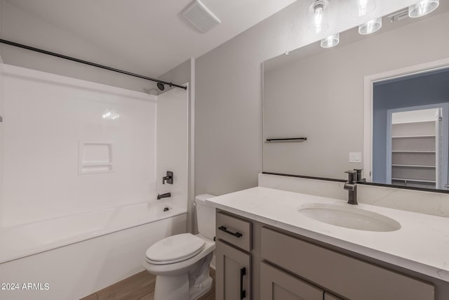 full bathroom featuring vanity, toilet, shower / bath combination, and wood-type flooring