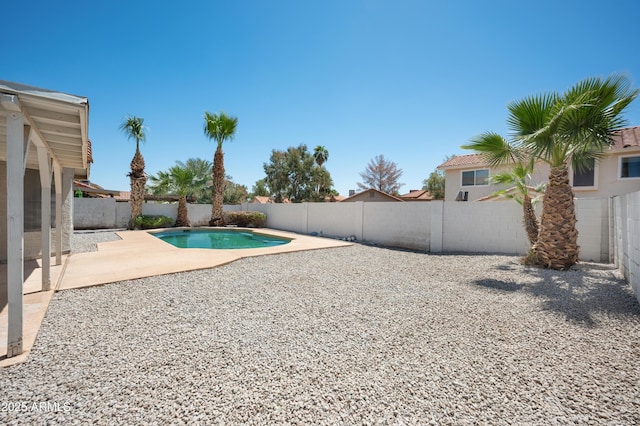 view of swimming pool featuring a fenced backyard, a patio area, and a fenced in pool