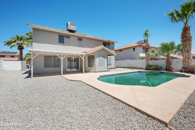 view of swimming pool featuring a patio area, a fenced in pool, a fenced backyard, and central AC