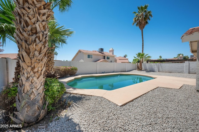 view of swimming pool featuring a patio area, a fenced in pool, and a fenced backyard