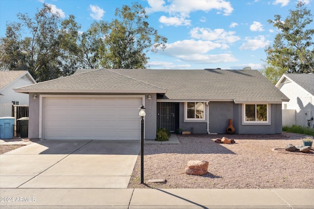 ranch-style home featuring a garage