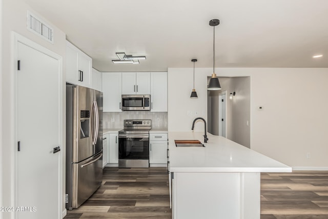 kitchen featuring dark hardwood / wood-style flooring, sink, white cabinets, and appliances with stainless steel finishes