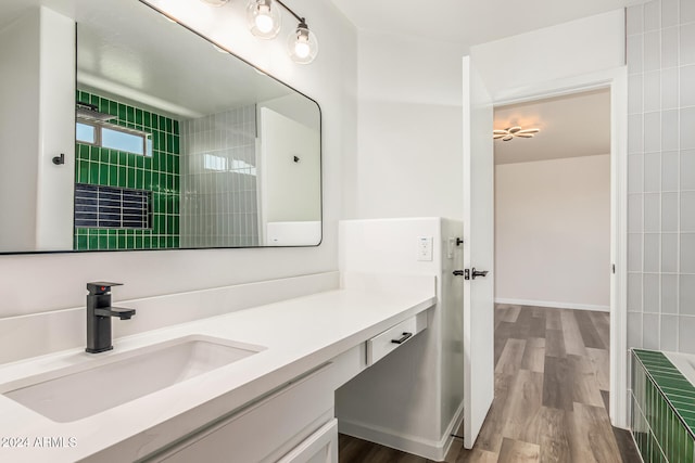 bathroom with hardwood / wood-style flooring and vanity