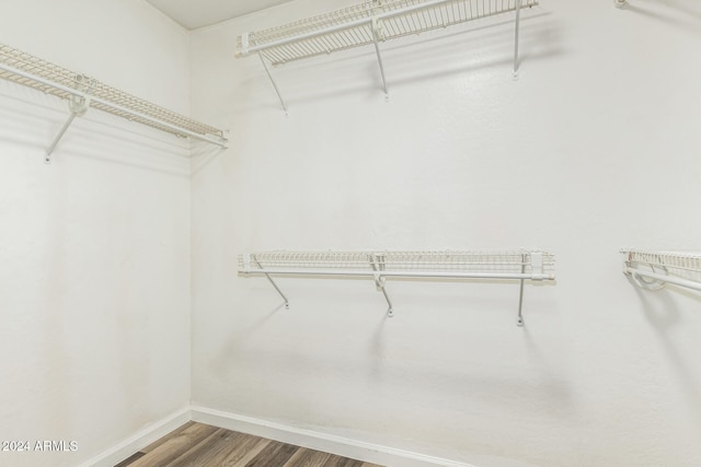 walk in closet featuring hardwood / wood-style flooring