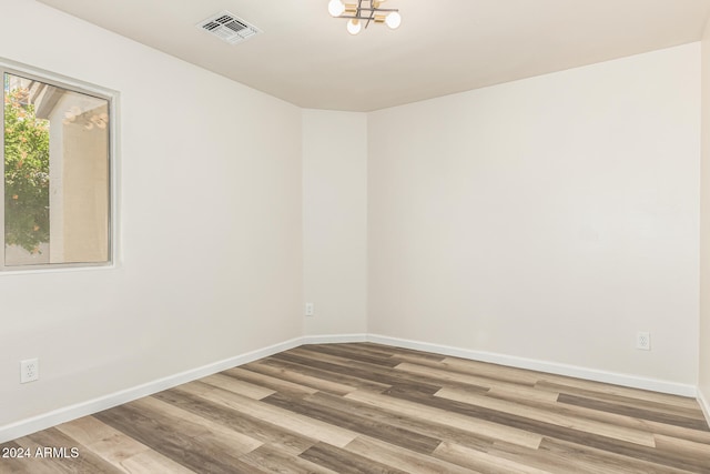 empty room featuring wood-type flooring