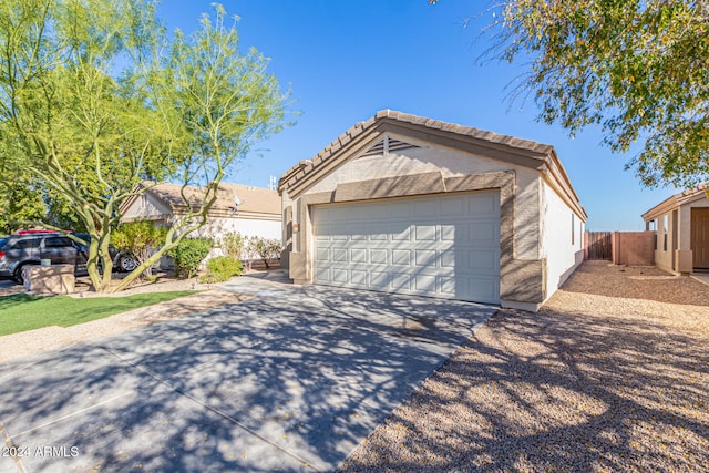ranch-style home with a garage