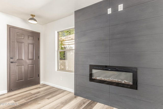 foyer entrance with light hardwood / wood-style flooring