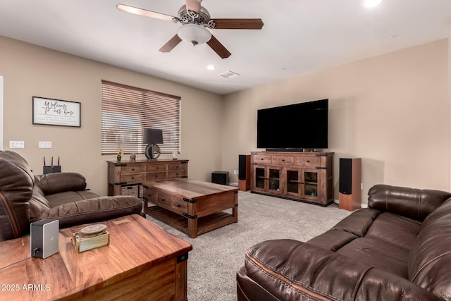 living room with light carpet and ceiling fan