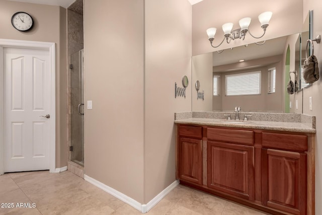 bathroom featuring vanity, an enclosed shower, and tile patterned flooring