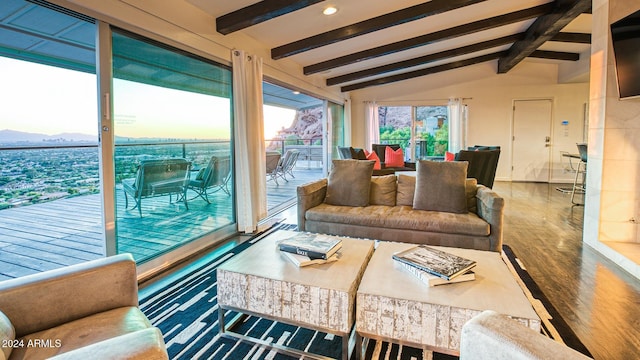 living room with lofted ceiling with beams and hardwood / wood-style floors