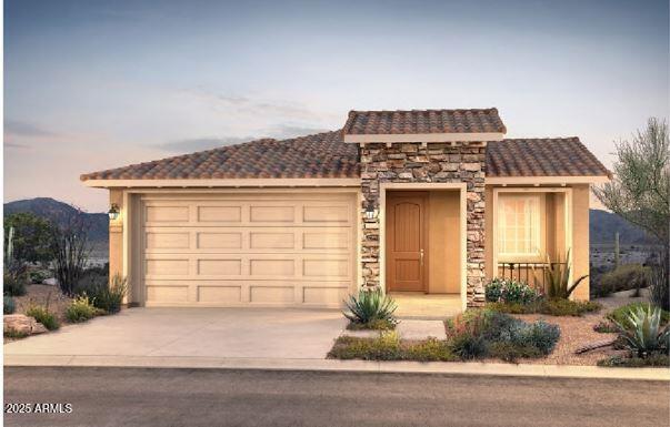 view of front of property featuring a garage, stone siding, a tile roof, and a mountain view