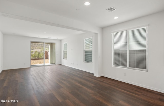 32076 N 136th Ave, Peoria, AZ 85383 - unfurnished room featuring dark wood-style flooring, recessed lighting, baseboards, and visible vents