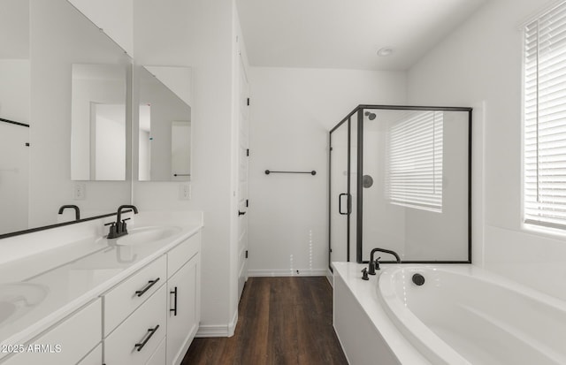 32076 N 136th Ave, Peoria, AZ 85383 - full bath featuring a sink, a garden tub, a shower stall, wood finished floors, and double vanity