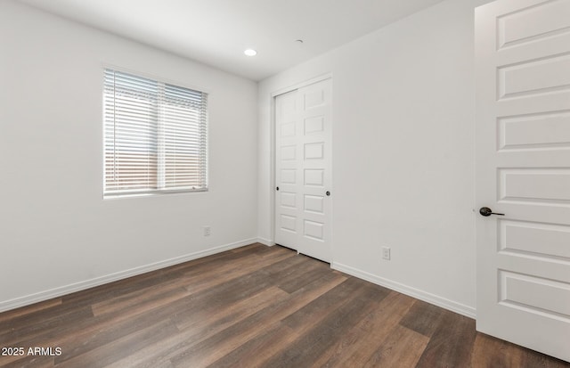 32076 N 136th Ave, Peoria, AZ 85383 - unfurnished bedroom with recessed lighting, a closet, baseboards, and dark wood finished floors