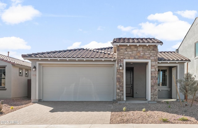32076 N 136th Ave, Peoria, AZ 85383 - view of front of house with stucco siding, an attached garage, a tile roof, and decorative driveway