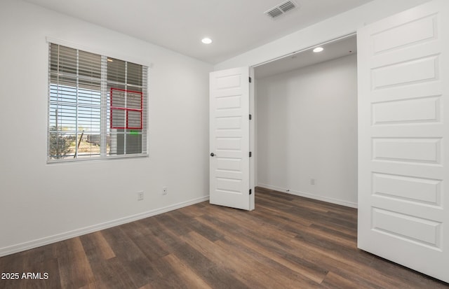 32076 N 136th Ave, Peoria, AZ 85383 - unfurnished bedroom featuring recessed lighting, dark wood-style floors, baseboards, and visible vents