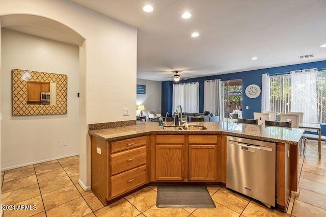 kitchen featuring ceiling fan, sink, stainless steel appliances, kitchen peninsula, and light tile patterned floors