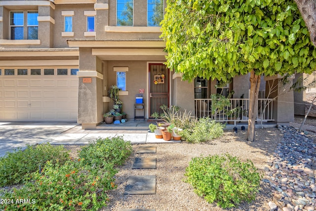 doorway to property with a garage