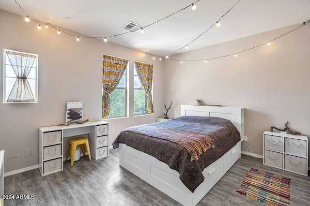 bedroom featuring wood-type flooring