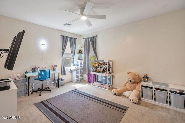 playroom featuring light carpet and ceiling fan