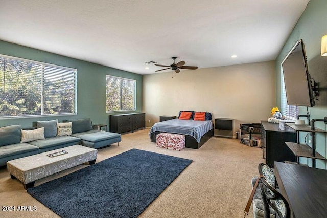 carpeted bedroom featuring ceiling fan