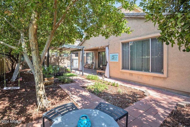 back of house featuring a patio area