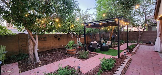 view of patio terrace at dusk