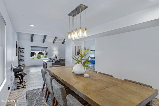 dining space featuring recessed lighting and beam ceiling