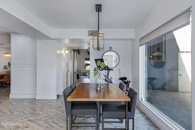 dining room with visible vents and baseboards