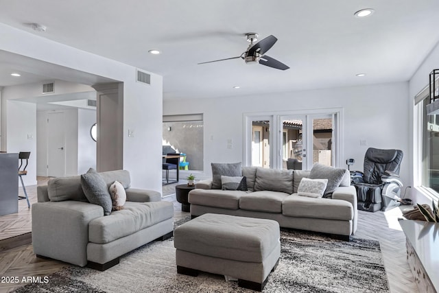 living area featuring a ceiling fan, visible vents, french doors, and recessed lighting