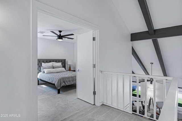 carpeted bedroom featuring vaulted ceiling with beams, visible vents, and a ceiling fan